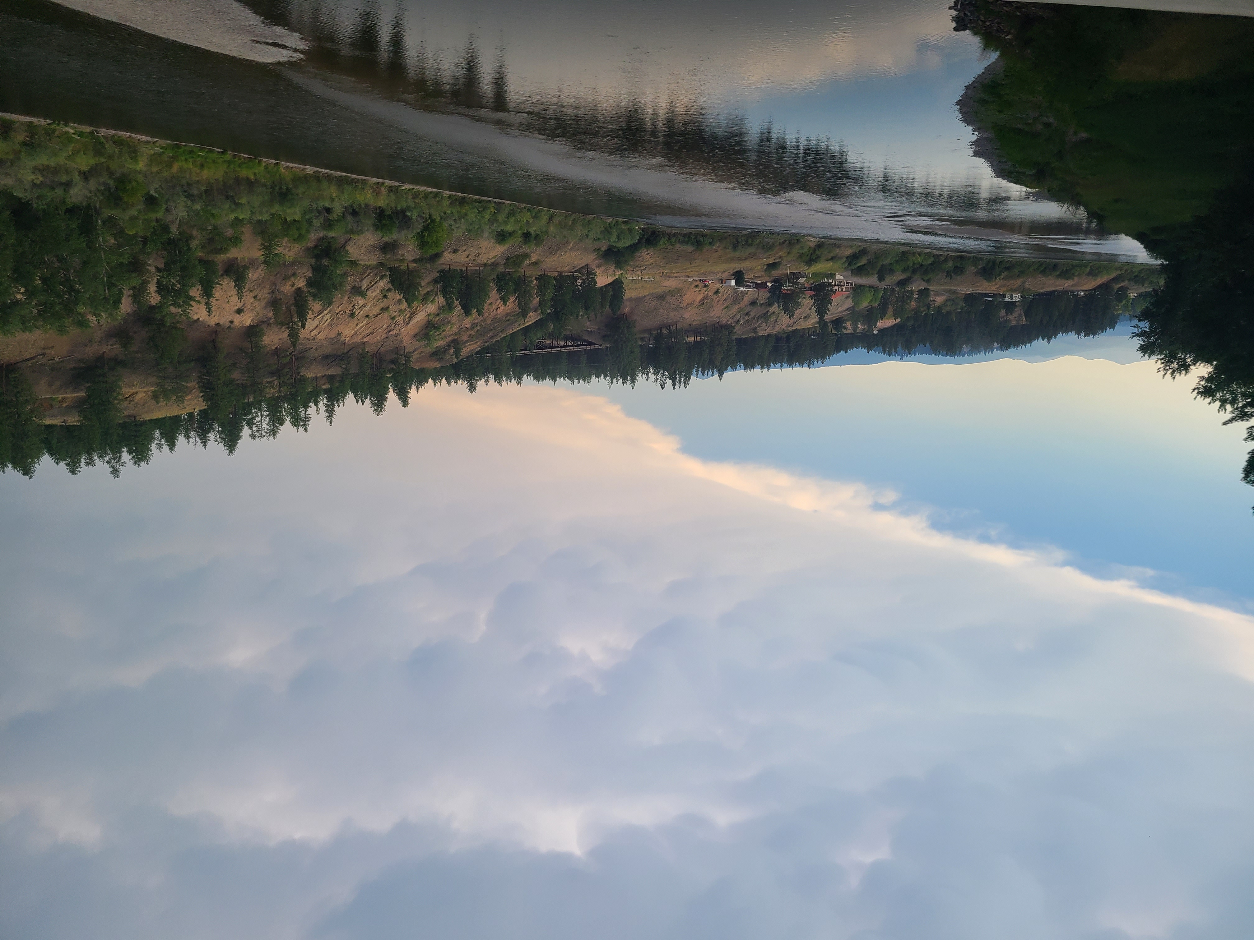 a photo of a river and clouds by Jodi VanDerVon